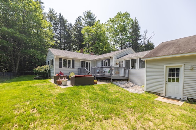 183 Buckfield Rd, Turner, ME 04282 - back of property with a wooden deck, outdoor lounge area, and roof with shingles