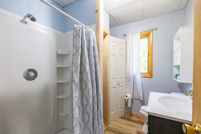 183 Buckfield Rd, Turner, ME 04282 - full bath with wood finished floors, a shower with shower curtain, toilet, a paneled ceiling, and vanity