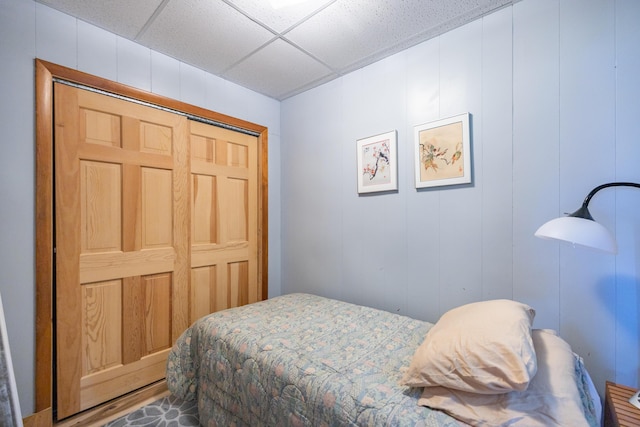 183 Buckfield Rd, Turner, ME 04282 - bedroom featuring a paneled ceiling, a closet, and a decorative wall