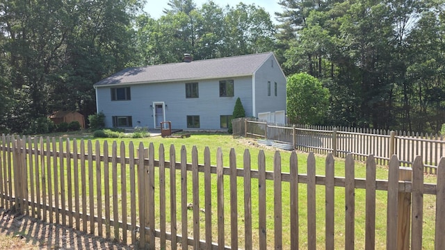 32 Long Hall Dr, Berwick, ME 03901 - view of front of property with a garage, roof with shingles, a fenced backyard, and view of wooded area