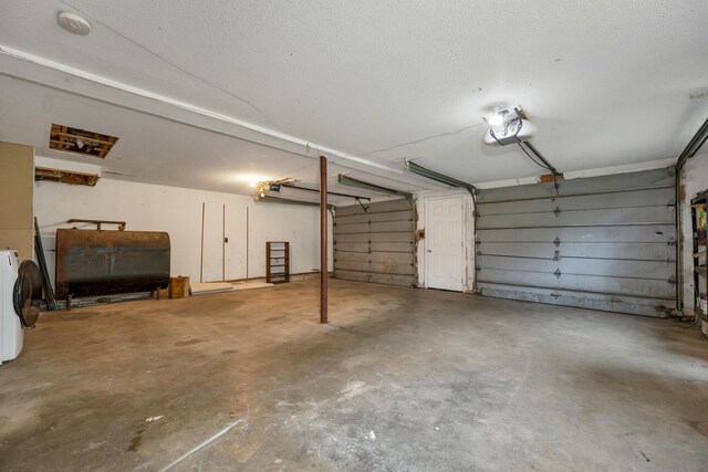 32 Long Hall Dr, Berwick, ME 03901 - garage with heating fuel, a garage door opener, and washer / dryer