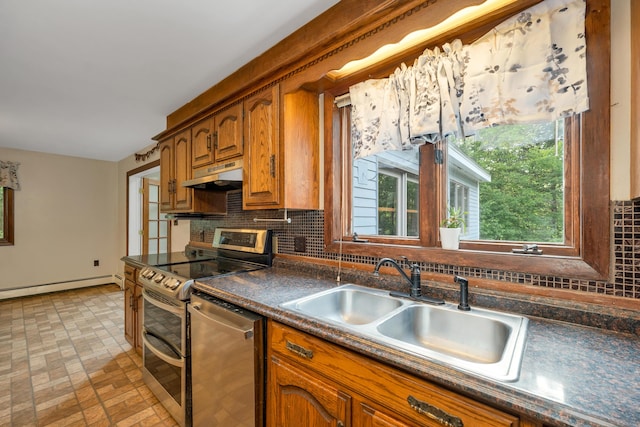 32 Long Hall Dr, Berwick, ME 03901 - kitchen with appliances with stainless steel finishes, under cabinet range hood, tasteful backsplash, brown cabinetry, and dark countertops
