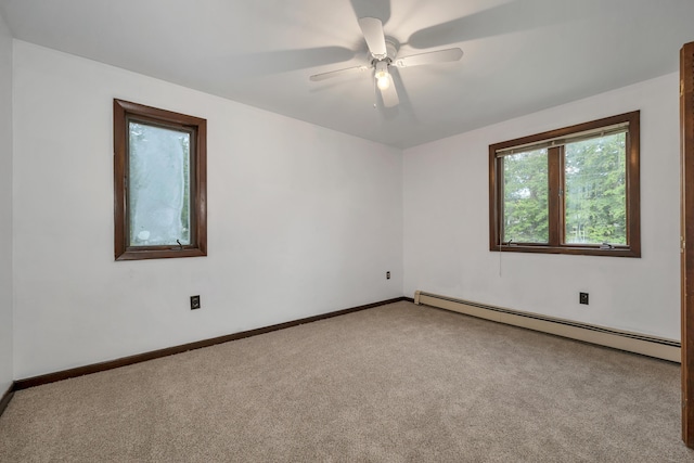 32 Long Hall Dr, Berwick, ME 03901 - empty room with a baseboard heating unit, carpet flooring, and ceiling fan