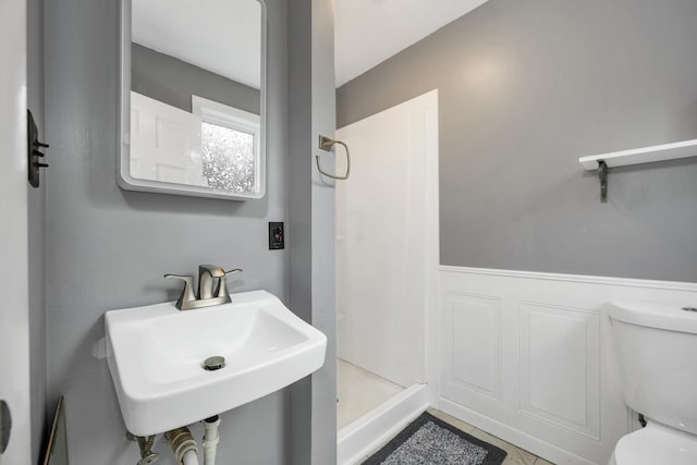 32 Long Hall Dr, Berwick, ME 03901 - bathroom featuring a shower stall and wainscoting