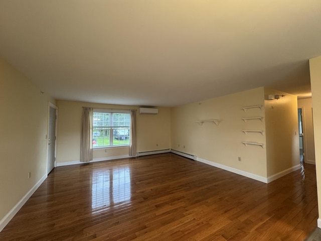 541 Kenduskeag Ave Unit A1, Bangor, ME 04401 - unfurnished room with a wall unit AC, dark wood-style flooring, baseboard heating, and baseboards