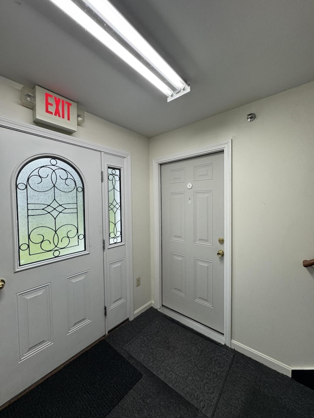 541 Kenduskeag Ave Unit A1, Bangor, ME 04401 - foyer entrance with baseboards and dark carpet