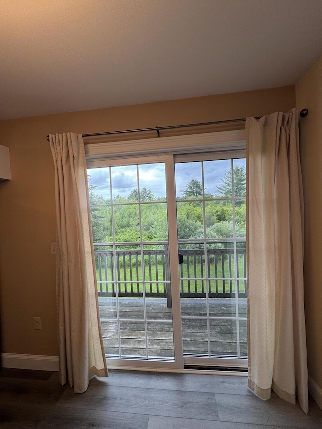541 Kenduskeag Ave Unit A1, Bangor, ME 04401 - doorway to outside featuring wood finished floors and baseboards