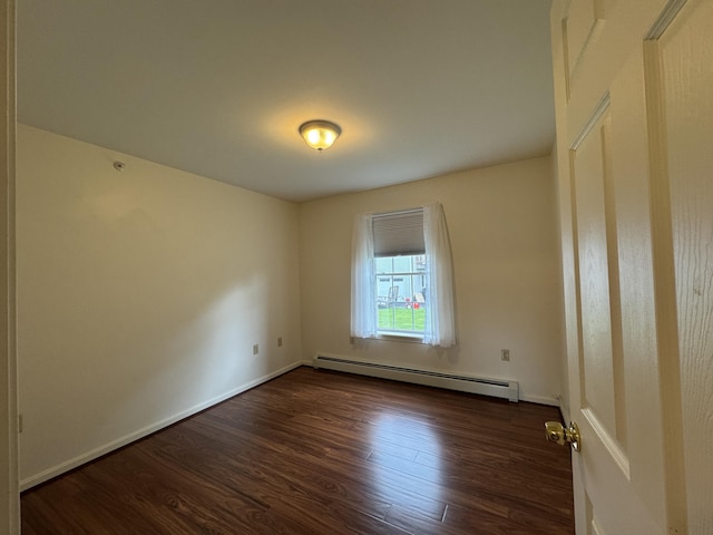 541 Kenduskeag Ave Unit A1, Bangor, ME 04401 - unfurnished room featuring baseboard heating, dark wood finished floors, and baseboards