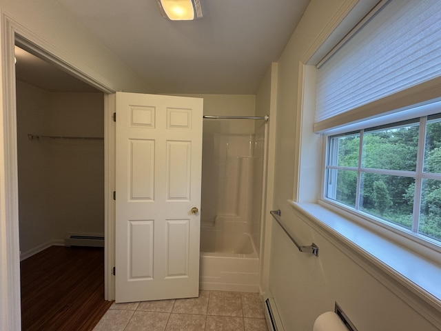 541 Kenduskeag Ave Unit A1, Bangor, ME 04401 - bathroom with baseboard heating, shower / tub combination, tile patterned flooring, a baseboard heating unit, and baseboards