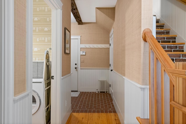 4 Shore Rd, Biddeford, ME 04005 - laundry area featuring brick patterned flooring, a wainscoted wall, radiator heating unit, and wallpapered walls