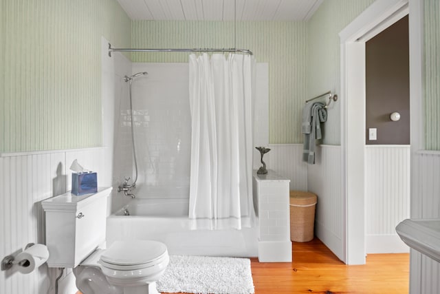 4 Shore Rd, Biddeford, ME 04005 - full bath with wainscoting, toilet, wood finished floors, shower / bathtub combination with curtain, and wallpapered walls