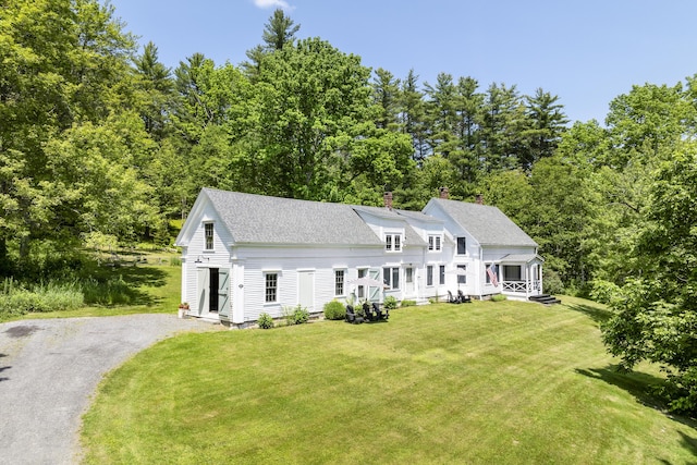 37 Walker Rd, Boothbay, ME 04537 - view of front of house featuring roof with shingles, a front lawn, asphalt driveway, and a chimney