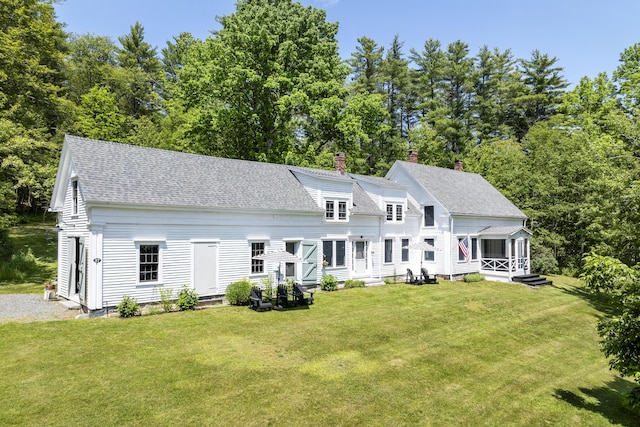 37 Walker Rd, Boothbay, ME 04537 - view of front facade with entry steps, a chimney, a shingled roof, and a front yard