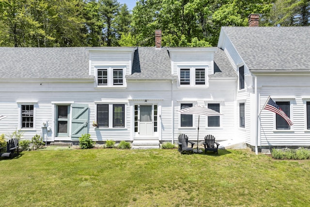 37 Walker Rd, Boothbay, ME 04537 - back of property featuring a chimney, a lawn, and a shingled roof