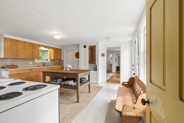 37 Walker Rd, Boothbay, ME 04537 - kitchen featuring electric stove, light countertops, brown cabinetry, and light floors