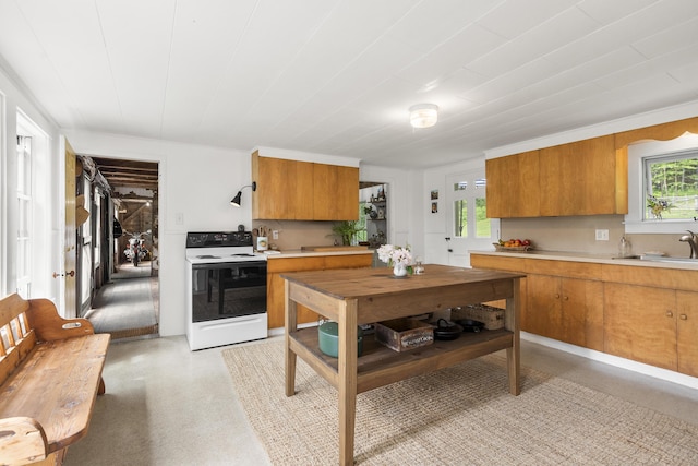 37 Walker Rd, Boothbay, ME 04537 - kitchen with white electric range oven, brown cabinetry, and light countertops