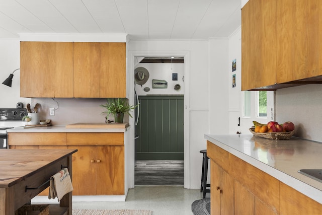 37 Walker Rd, Boothbay, ME 04537 - kitchen featuring electric range, light countertops, and brown cabinetry
