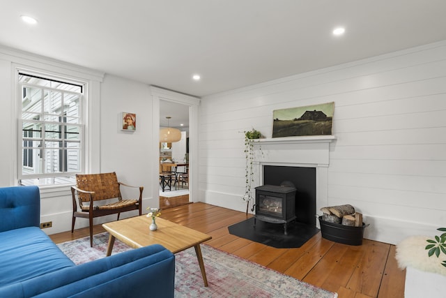 37 Walker Rd, Boothbay, ME 04537 - living area featuring hardwood / wood-style flooring, a wood stove, recessed lighting, and wooden walls