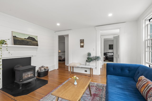 37 Walker Rd, Boothbay, ME 04537 - living room featuring wood-type flooring, recessed lighting, wooden walls, and a wood stove