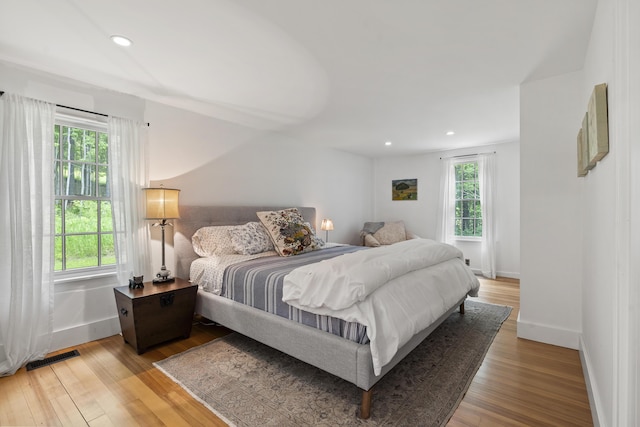 37 Walker Rd, Boothbay, ME 04537 - bedroom with multiple windows, wood finished floors, and recessed lighting