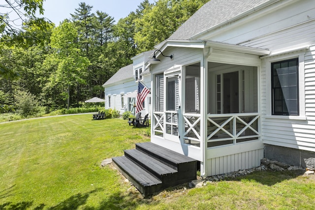 37 Walker Rd, Boothbay, ME 04537 - view of home's exterior with a sunroom, a yard, entry steps, and roof with shingles