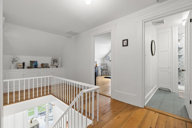 37 Walker Rd, Boothbay, ME 04537 - hall featuring an upstairs landing, light wood finished floors, and vaulted ceiling