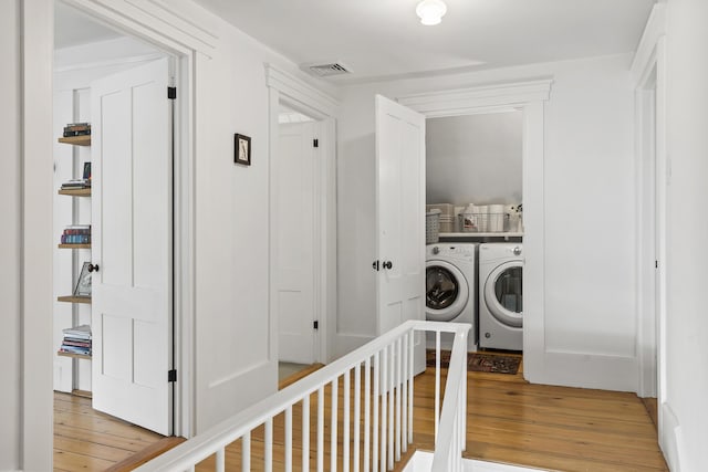 37 Walker Rd, Boothbay, ME 04537 - laundry room featuring light wood-type flooring and washing machine and dryer