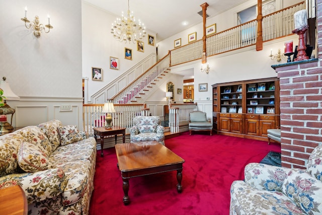 30 Plymouth Dr, Saco, ME 04072 - living room featuring a decorative wall, carpet, a high ceiling, stairway, and wainscoting