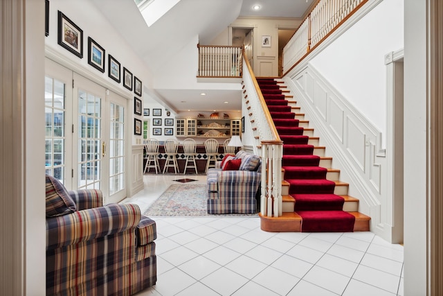 30 Plymouth Dr, Saco, ME 04072 - foyer entrance with stairway, a high ceiling, tile patterned floors, and a skylight