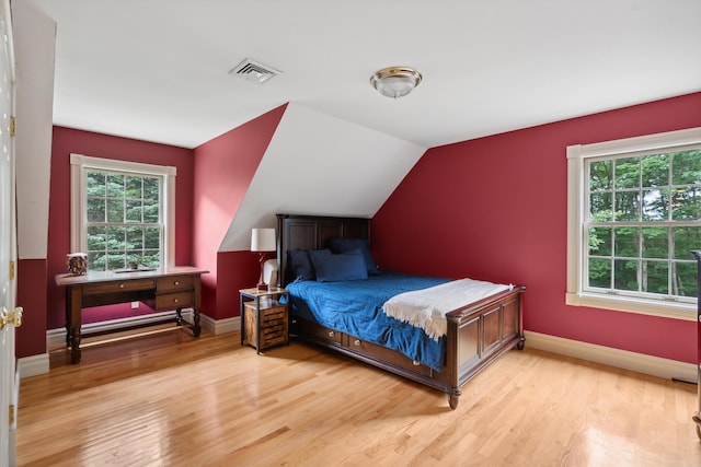 30 Plymouth Dr, Saco, ME 04072 - bedroom featuring multiple windows, light wood finished floors, baseboards, and vaulted ceiling