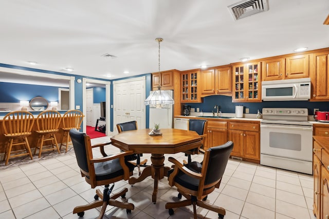 30 Plymouth Dr, Saco, ME 04072 - kitchen featuring white appliances, a sink, brown cabinets, glass insert cabinets, and recessed lighting