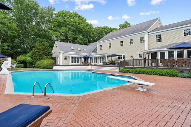 30 Plymouth Dr, Saco, ME 04072 - outdoor pool featuring a deck, a diving board, and a patio