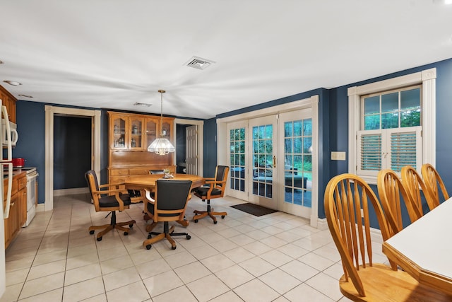 30 Plymouth Dr, Saco, ME 04072 - dining area with french doors, light tile patterned floors, and baseboards