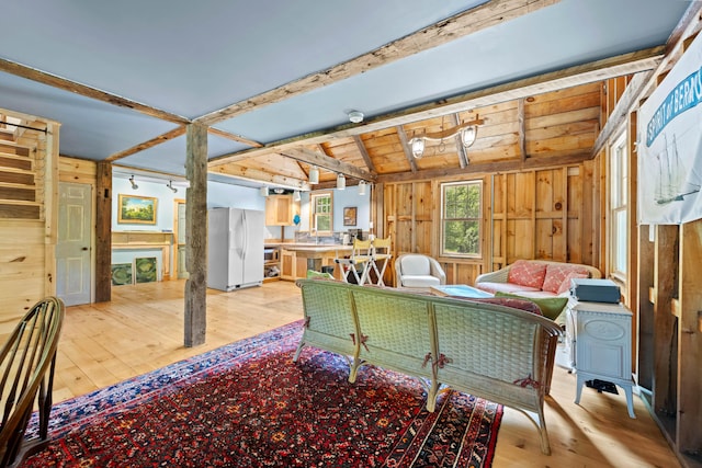 72 Vine St, South Berwick, ME 03908 - living area featuring light wood-style floors, wooden walls, and vaulted ceiling