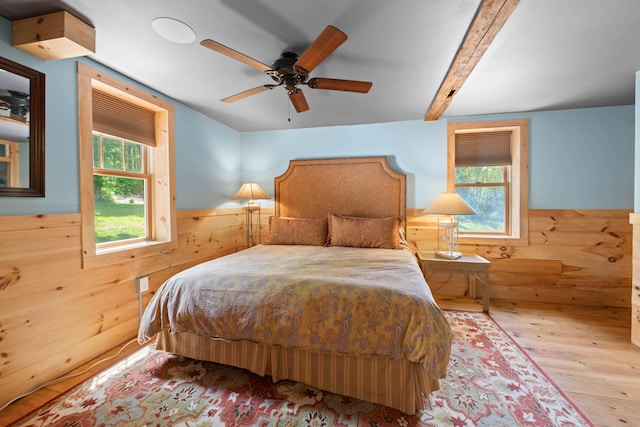 72 Vine St, South Berwick, ME 03908 - bedroom featuring wood finished floors, a wainscoted wall, wooden walls, and a ceiling fan