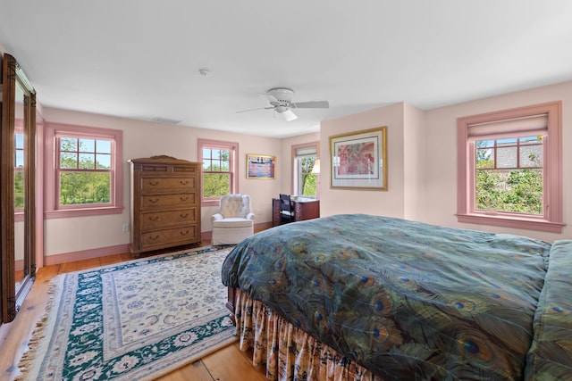 72 Vine St, South Berwick, ME 03908 - bedroom with multiple windows, wood finished floors, baseboards, and a ceiling fan
