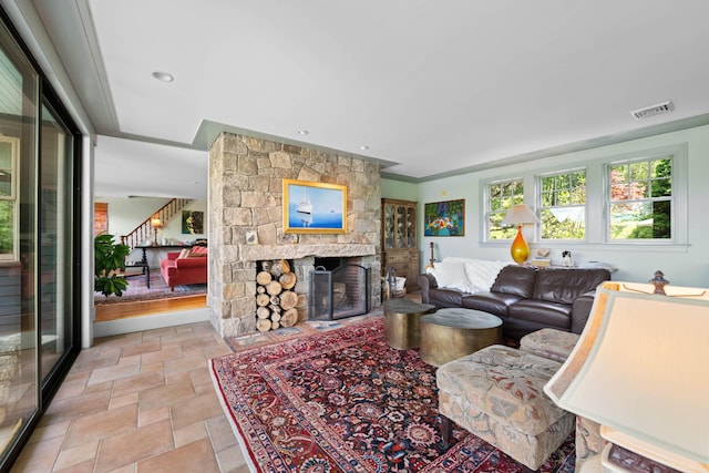 72 Vine St, South Berwick, ME 03908 - living room featuring stone tile flooring, stairway, and a stone fireplace
