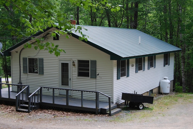 16 Evergreen Estates Rd, Nobleboro, ME 04555 - view of front facade featuring a chimney and a metal roof