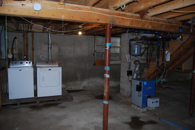 16 Evergreen Estates Rd, Nobleboro, ME 04555 - unfinished below grade area featuring washing machine and dryer and a heating unit