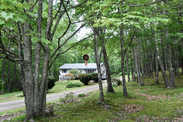 16 Evergreen Estates Rd, Nobleboro, ME 04555 - ranch-style house with a forest view and a chimney