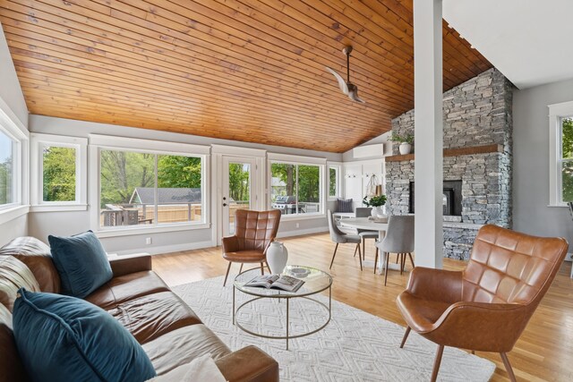 217 Ocean Ave, Portland, ME 04103 - living room featuring lofted ceiling, wooden ceiling, a fireplace, and wood finished floors