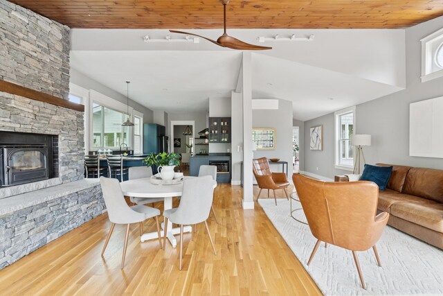 217 Ocean Ave, Portland, ME 04103 - dining area with a fireplace, plenty of natural light, light wood-style floors, wooden ceiling, and vaulted ceiling