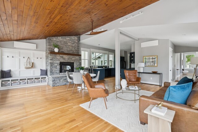 217 Ocean Ave, Portland, ME 04103 - living room featuring vaulted ceiling, wood finished floors, and a fireplace