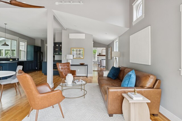217 Ocean Ave, Portland, ME 04103 - living room featuring light wood finished floors, high vaulted ceiling, and baseboards