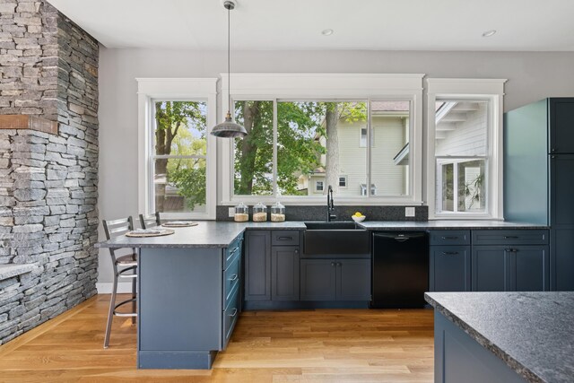217 Ocean Ave, Portland, ME 04103 - kitchen with dishwasher, a sink, healthy amount of natural light, and a kitchen bar