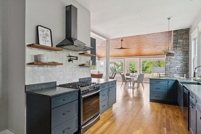 217 Ocean Ave, Portland, ME 04103 - kitchen featuring appliances with stainless steel finishes, island exhaust hood, open shelves, backsplash, and a ceiling fan