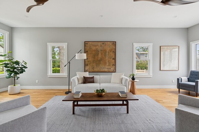 217 Ocean Ave, Portland, ME 04103 - living room featuring ceiling fan, light wood finished floors, and baseboards