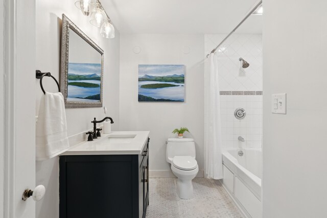 217 Ocean Ave, Portland, ME 04103 - full bath with toilet, vanity, speckle patterned floor, shower / bath combo with shower curtain, and baseboards