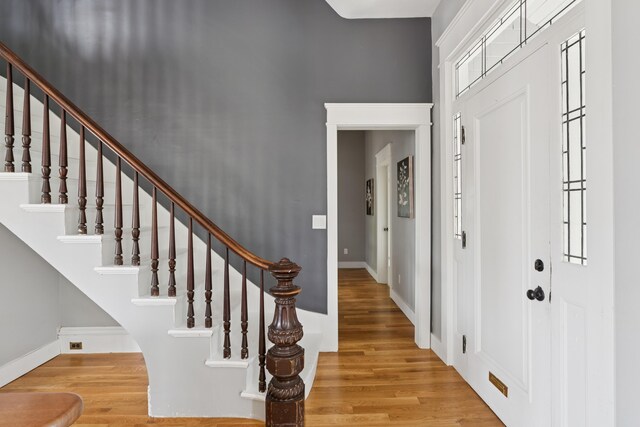 217 Ocean Ave, Portland, ME 04103 - entrance foyer featuring wood finished floors, baseboards, and stairway