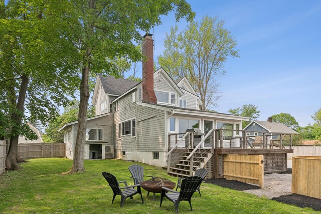 217 Ocean Ave, Portland, ME 04103 - back of property with stairway, an outdoor fire pit, a deck, and a chimney